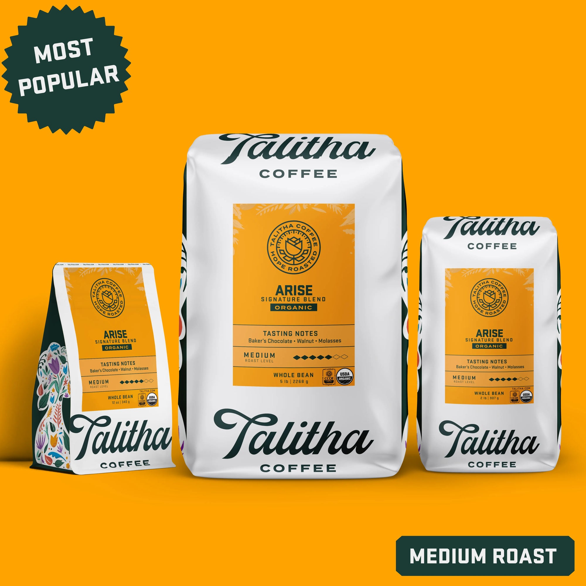 Three bags of organic Talitha Arise Blend Coffee labeled medium roast and most popular