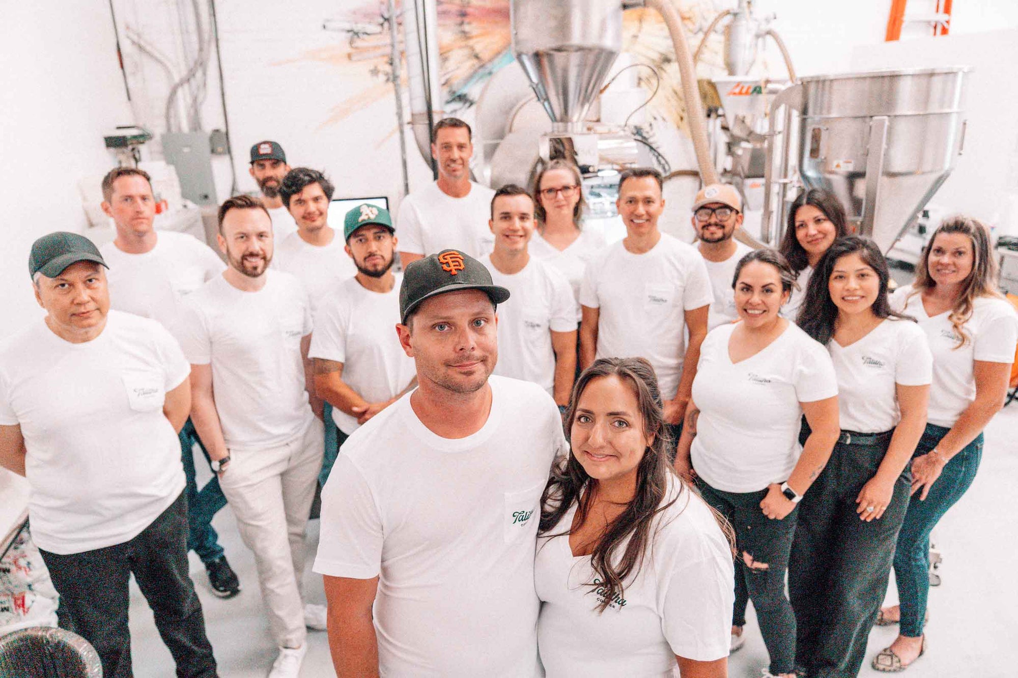Talitha staff standing in front of the coffee roaster