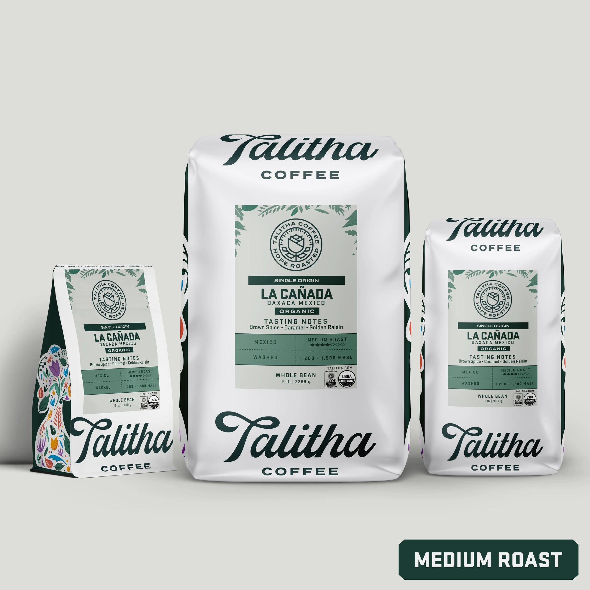 Multiple bags of Organic Talitha Mexico Single Origin Medium roast coffee on white background