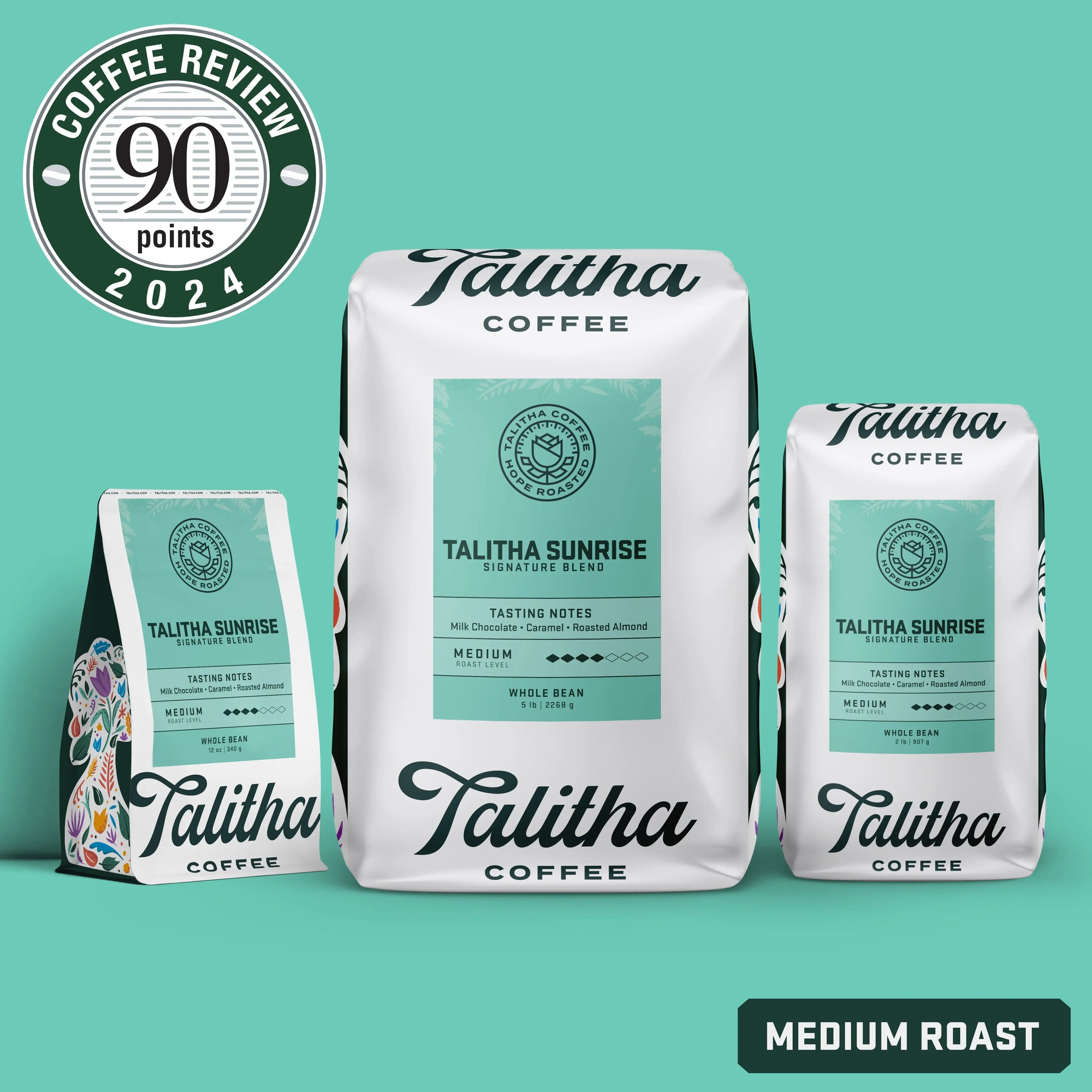 Three bags of Talitha Sunrise blend medium roast on teal background. Sticker of coffee review score 90 points in 2024