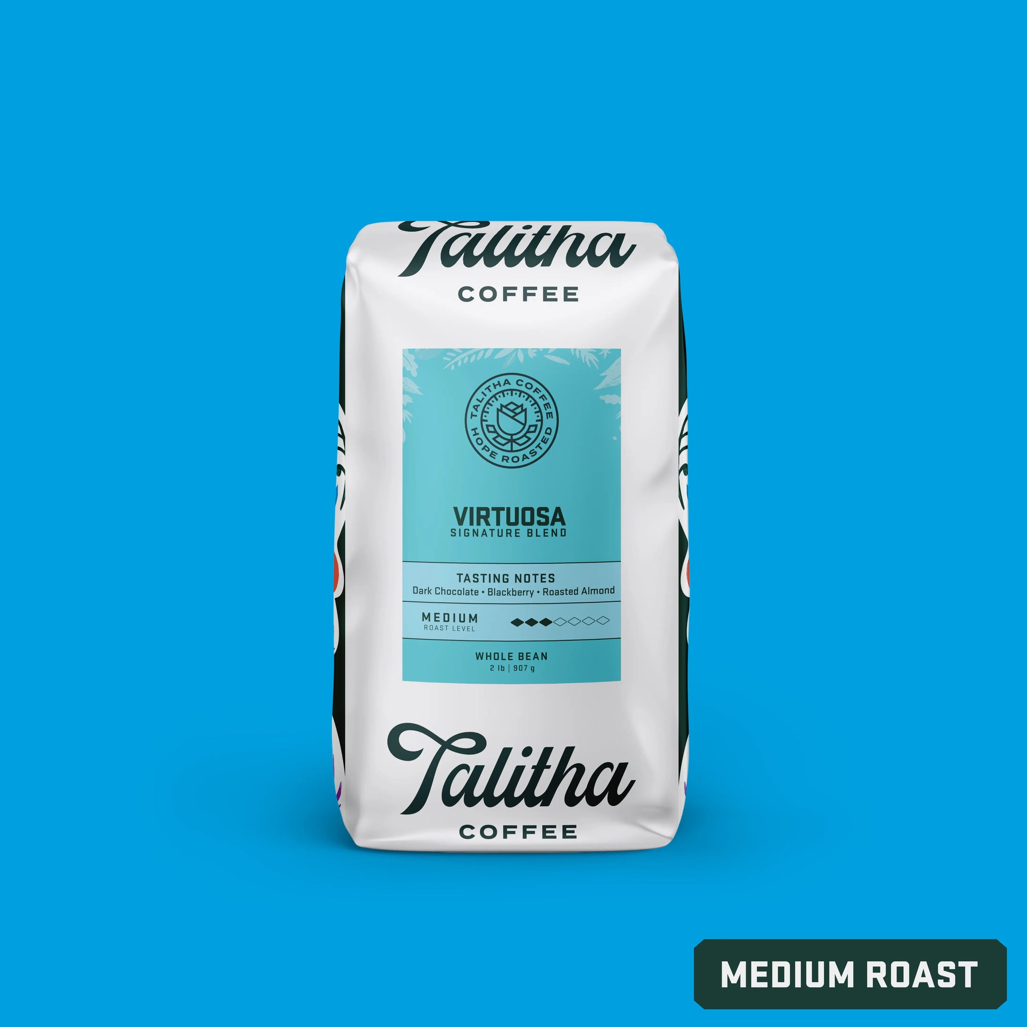 A package of Talitha Coffee's Virtuosa signature blend, indicating medium roast and showing the brand's logo and the words 'signature blend' on the front.