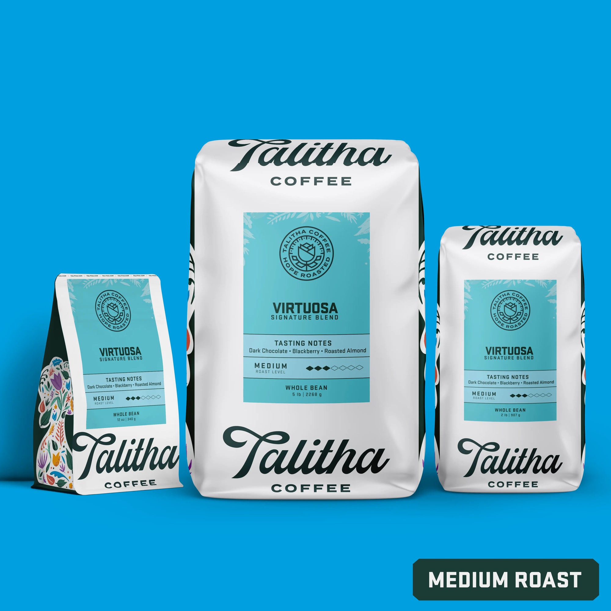 bags of Talitha Virtuosa medum roast blend on blue background